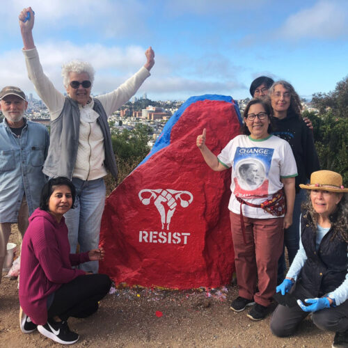 Resist Fist on Bernal Rock with painters
